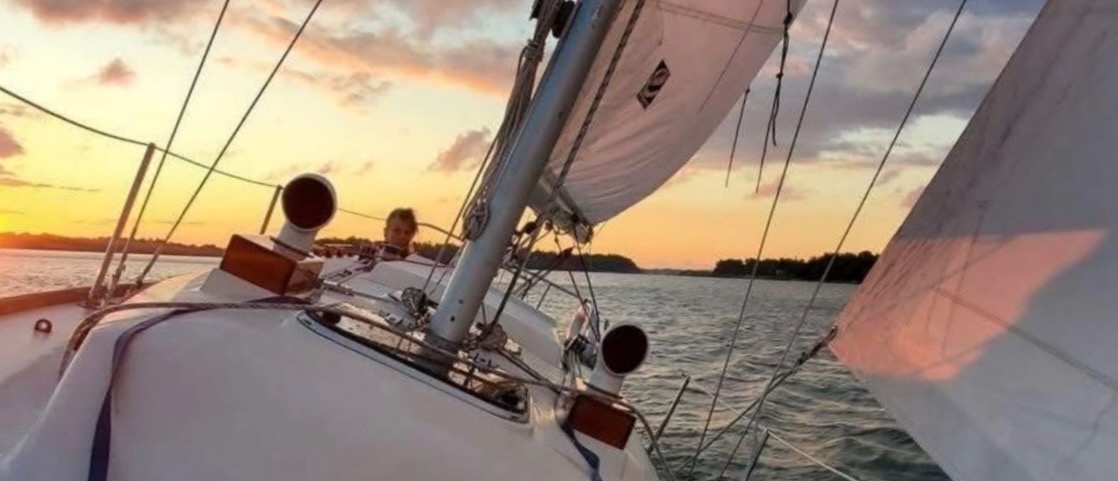 Sailing at sunset aboard the boat